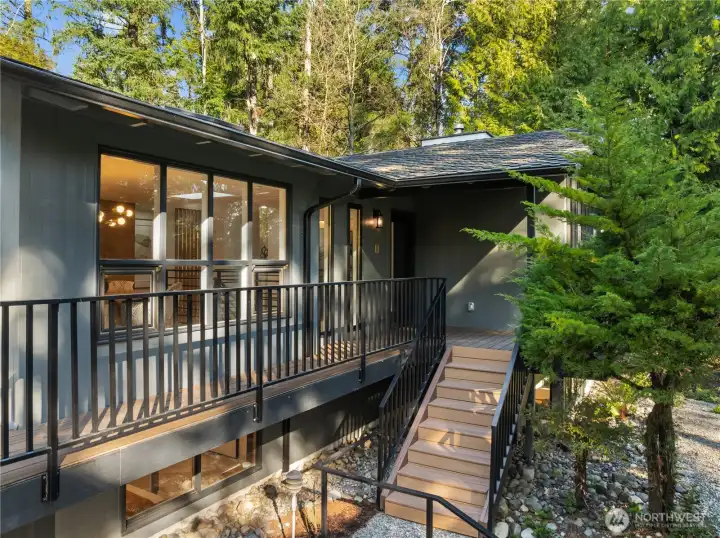 Updated railings, refreshed decking, and expansive outdoor living spaces create effortless indoor-outdoor flow.