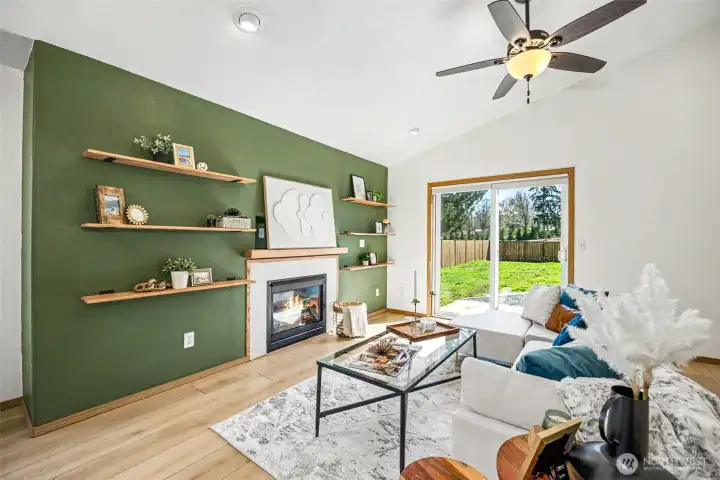 Light and bright living room with fireplace.