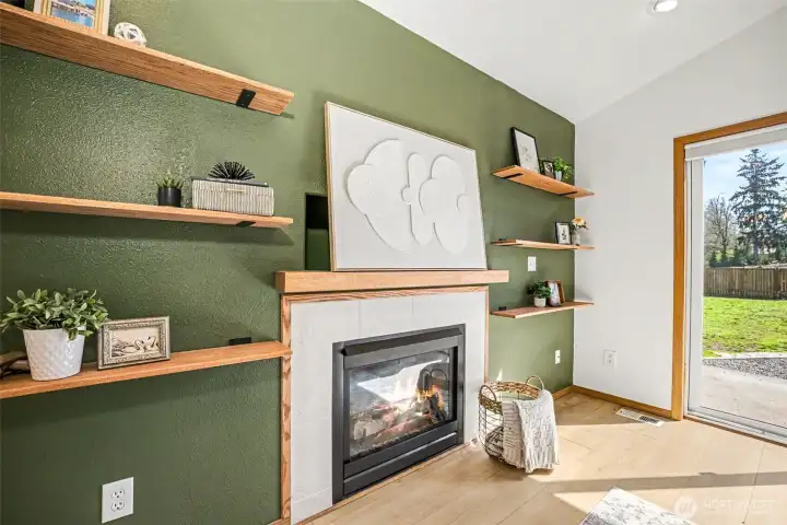 Gas fireplace with fun accent wall ready for your decor.