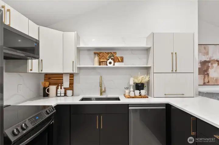 Sleek quartz countertops create a cohesive design aesthetic paired with energy-efficient smart appliances included with the home.