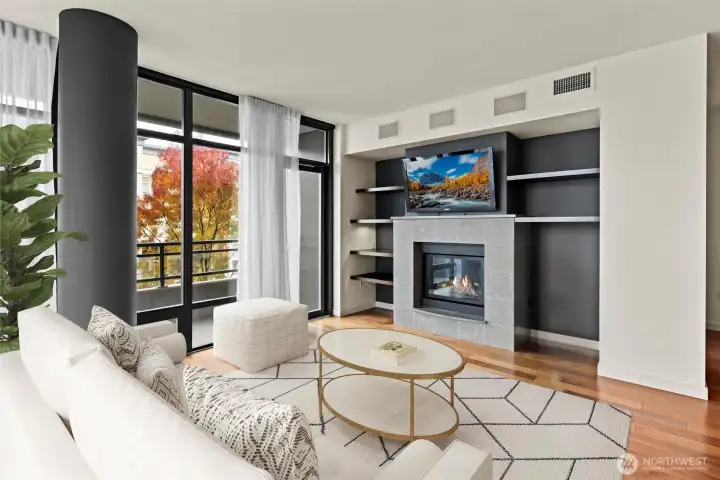 Sophisticated and casually chic! A statement fireplace anchors the room, thoughtfully centered to create a warm gathering space, and elegantly flanked by custom-built shelving.