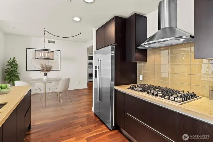 Kitchen flows seamlessly to dining spaces. Gas high end Bosch Cooktop.