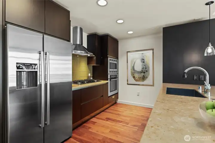 Chef's kitchen with upgraded Bosch gas appliances and custom SieMatic cabinetry.