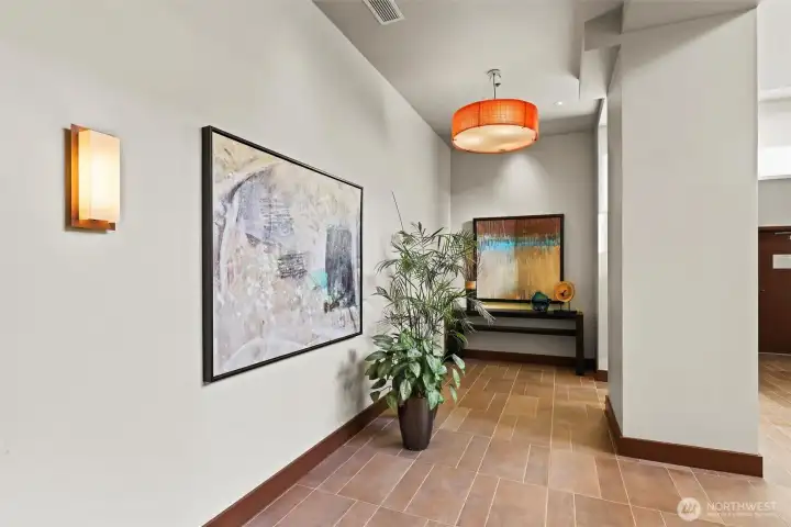 Elevator area with mail access and storage.