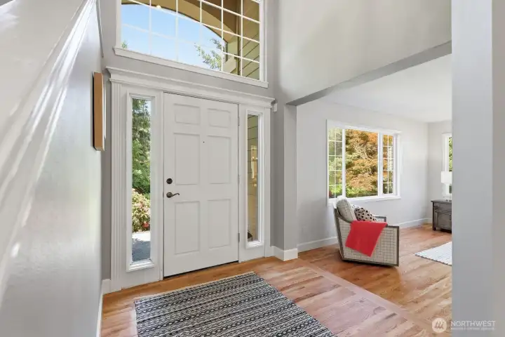 Step inside to soaring vaulted ceilings and expansive windows that flood the home with natural light.