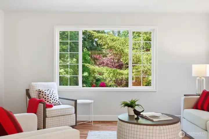Surrounded by vibrant landscaping and peaceful greenery, creating beautiful outlooks from nearly every window.