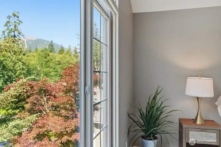 Wake up to breathtaking views of majestic Mt. Si from the comfort of your primary bedroom.