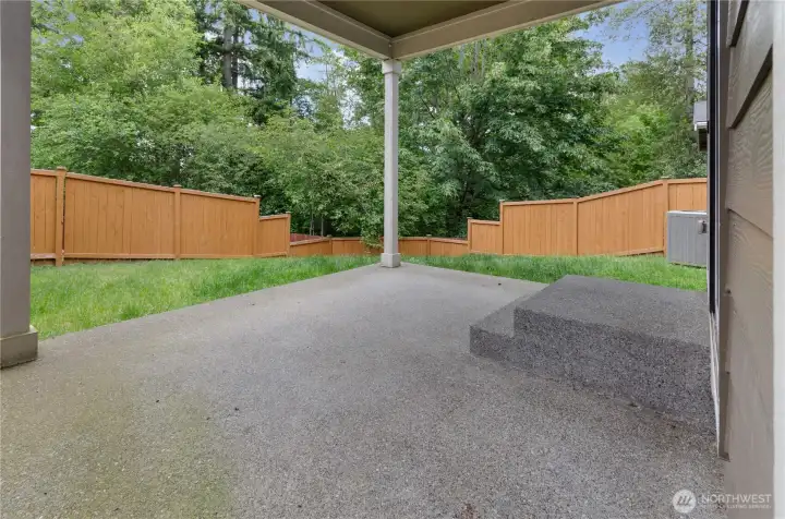 Covered back patio to enjoy your private lot