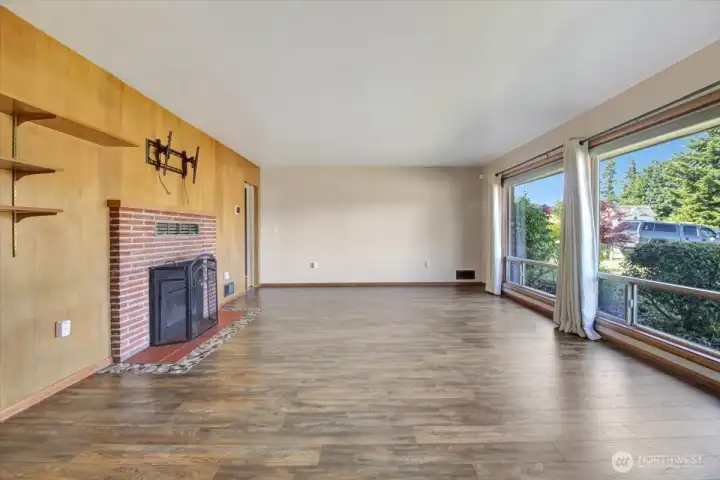 Living room to the right of the entry. Custom panelled wall and gas fireplace. This room is huge! Living room to the right of the entry. Custom panelled wall and gas fireplace. This room is huge!