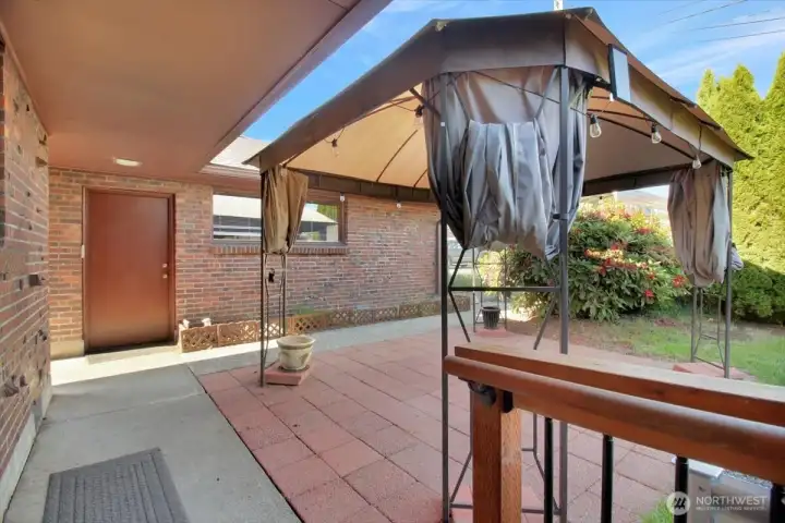 Covered walkway between the house and the detached garage. Covered walkway between the house and the detached garage.