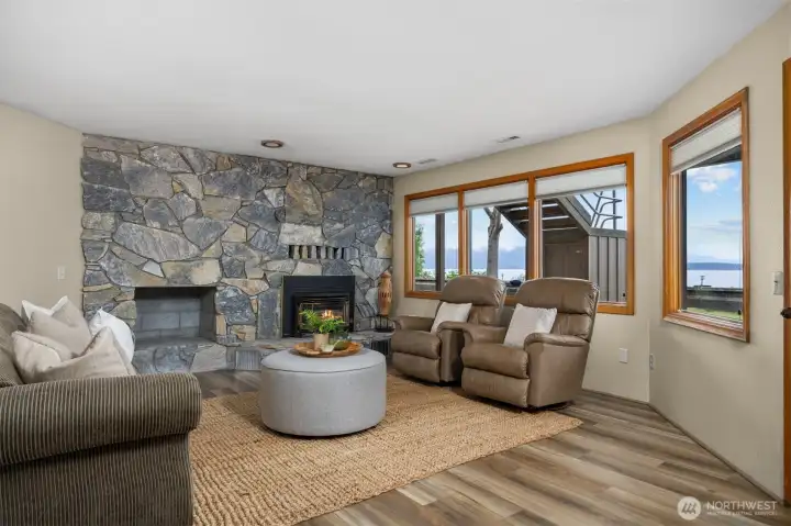 The family room also has a gas fireplace insert and has a stone surround. There is a patio just off the spacious family room.