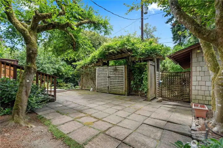 Private Interior of the Courtyard - Cozy Location to Bird Watch. Wisteria grows along the top of the arbor.