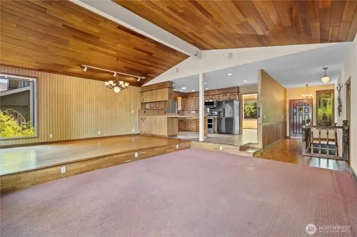 View of Living, Dining and Kitchen areas facing the Front Door, with views into the Mud/Craft/Laundry Room.