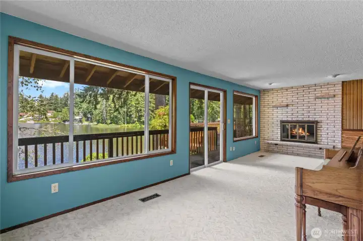 Family Rm w/Wood Burning Brick Surround Fireplace & Outstanding Views of the Lake! Carpets are pristine! This could be an excellent Primary Bedroom on the Main Floor w/a Few Modifications!