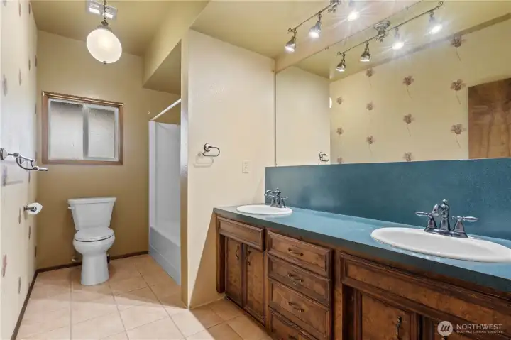 Basement Full Bath w/Tile Floors and Full partially updated Bath.