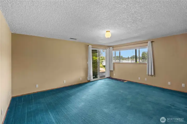 Basement Bedroom w/Bright, Clean Carpet. Slider to Private Patio w/Lake Access. Full Closet Wall to the Right, not shown.