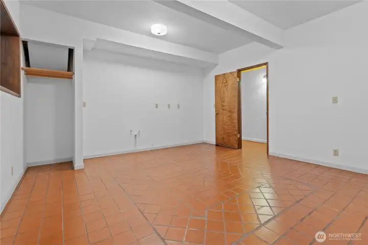 Basement: Tiled Room was originally going to house a 2nd Kitchen - notice the plumbing in the far wall. Seller never installed, but it's it's setup to do so. Could be a great Catering Kitchen or Wet Bar and Living Space Combo!