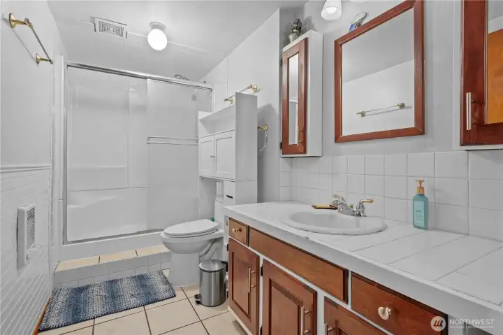 Full Bath w/Tile Counters and Floors, Fiberglass Tub/Shower and Cadet Heating.