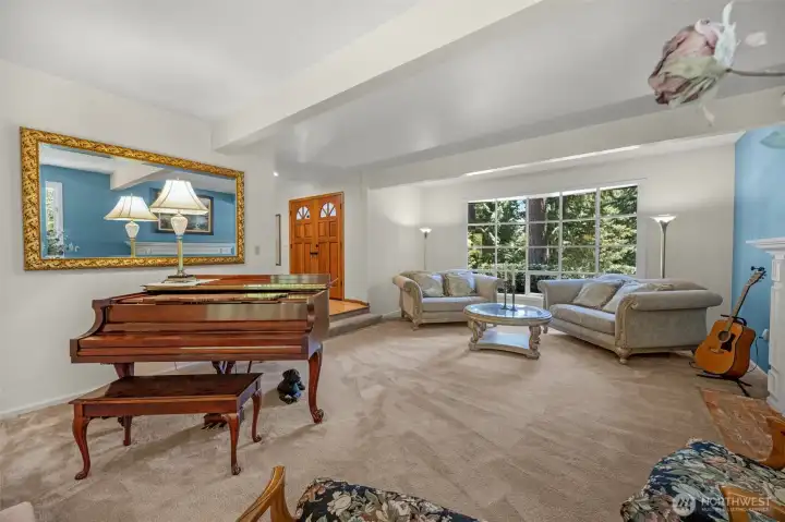 Spacious Living Room with wood burning fireplace.