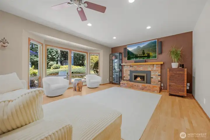 Big family room with tall bay windows. Gas fireplace.