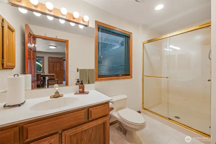 3/4 Bath off primary suite on main floor.