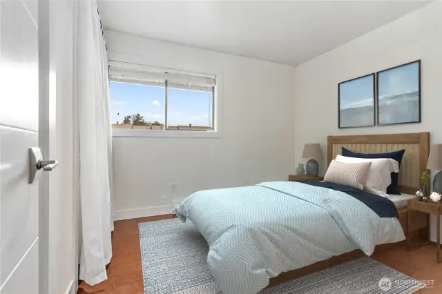 2nd bedroom on the other side of the bathroom and at the opposite end of the hall from the primary. Virtually staged.