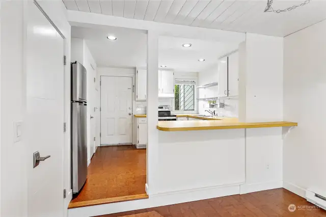 One step down from the kitchen into the dining area.