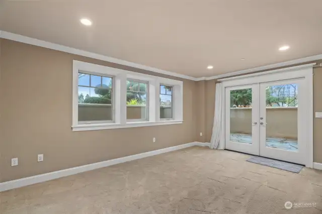 Endless options for the lower level den/bonus with French doors to a serene private outdoor patio!