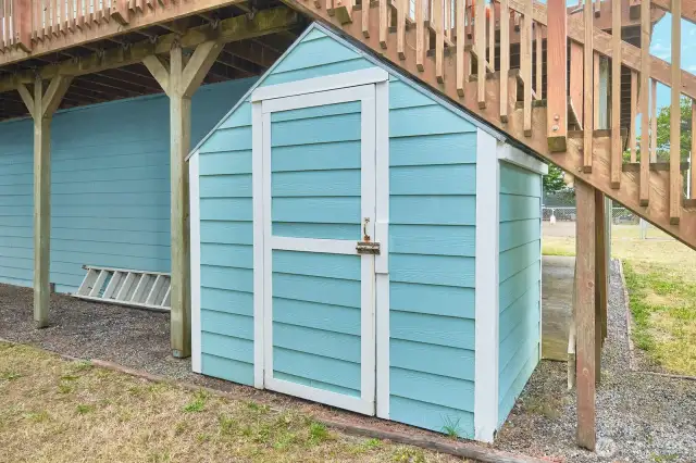 Shed tucked under the deck stairs to store clamming or fishing gear and etc.