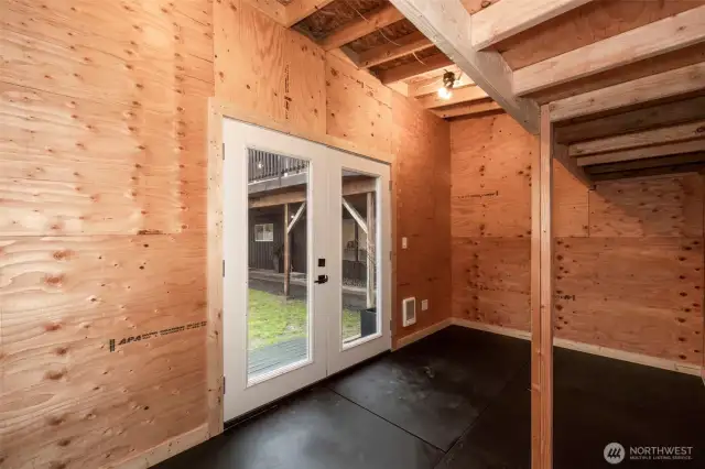 Backyard Multi-use studio- Double wall construction, fully insulated with electrical and heat. Glass French doors and composite decking ramp.