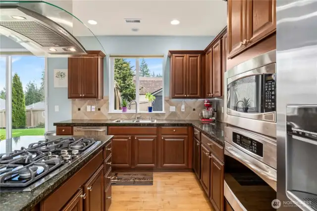 Another view of Kitchen with SS appliances and under cabinet ligthing