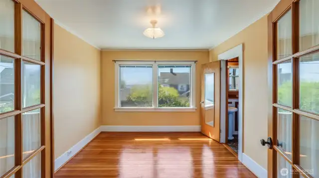 Upstairs: French doors to primary bedroom.
