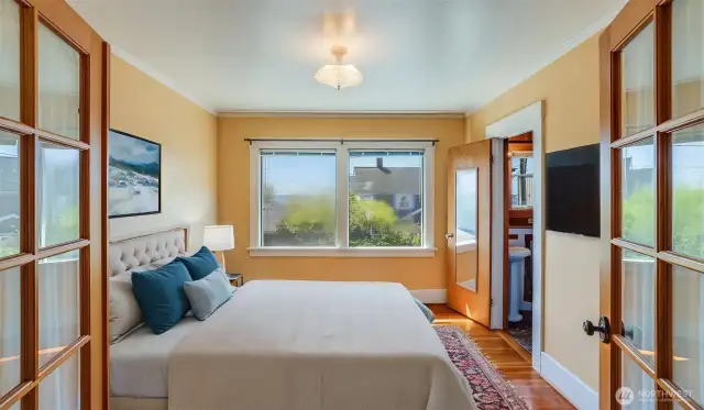 Upstairs: Primary bedroom virtually staged.