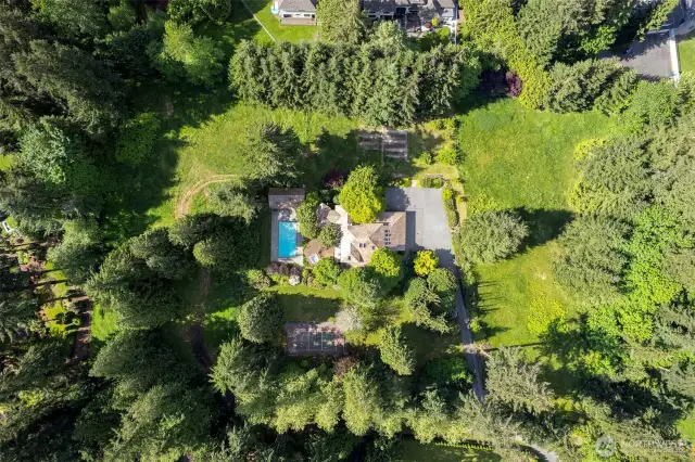 Highly desirable, beautiful estate on 4 flat, usable acres, fenced, gardens, orchard...so much to offer!