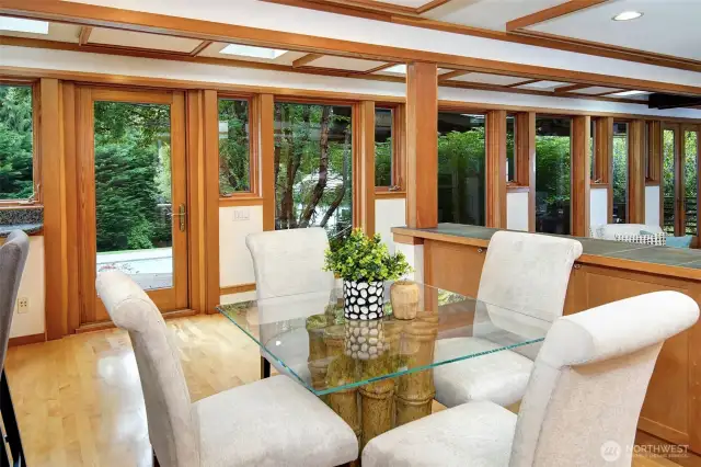 Light-filled informal eating area with glass door to deck for outdoor enjoyment.