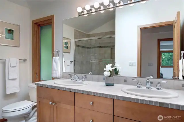 Upper level full bath with tub and shower.