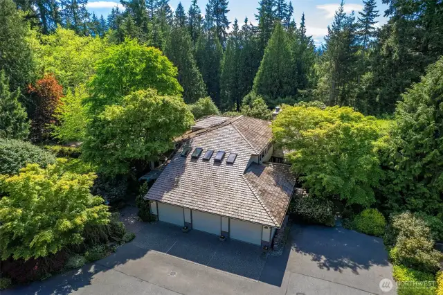 Three car garage home surrounded by amazing land.