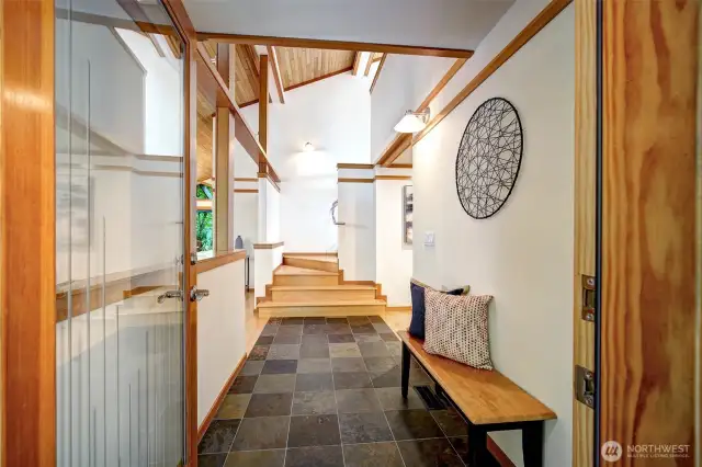 Stunning entry with fir beams and cedar ceilings.