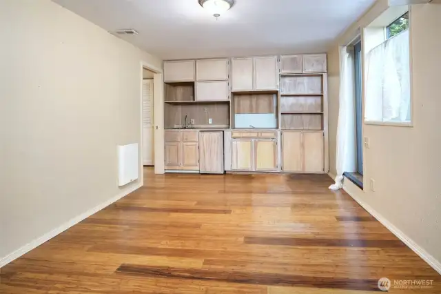 This is the lower level Bonus Room, at the rear of the home. It's been used as a TV room, as a bedroom, as a Craft space- the door to the right of the picture leads to the rear yard.