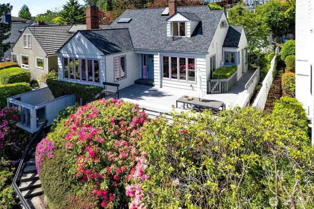 Another front view, showing the large deck and enclosed front patio.
