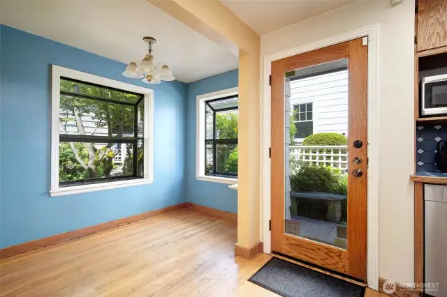 This door, between the kitchen and the breakfast nook, leads to the deck. Right to the front & views, left to the garage and private patio.
