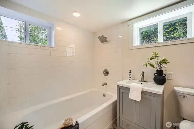 The full bathroom on the lower level also has an oversized tub and flooring is cohesive throughout the bathrooms. Attention to detail is at the heart of this home.
