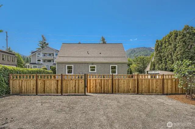 Plenty of access to the home from both sides - with the backside of the home featuring parking for 5 vehicles, with additional street parking across Sunset Way.