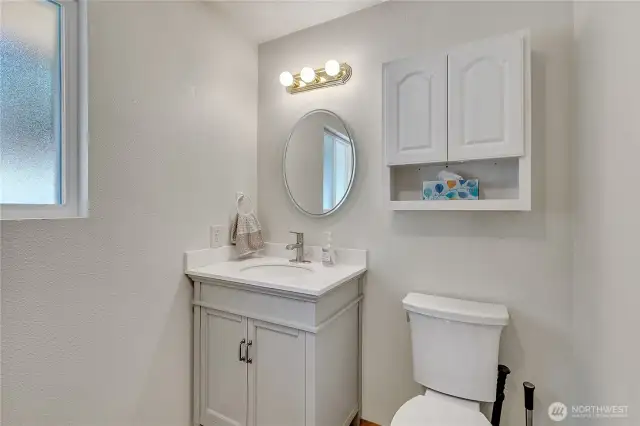 Updated half bath off family room/rec area ~