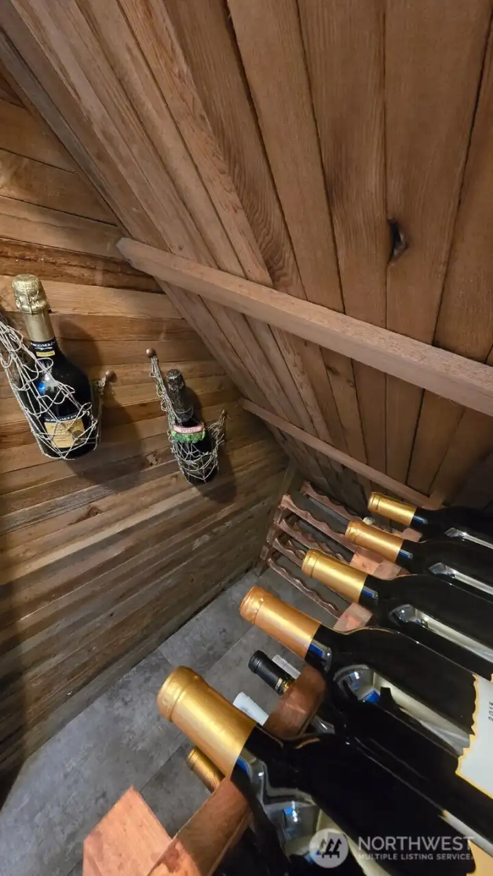 Custom made cedar wine closet under stairs.
