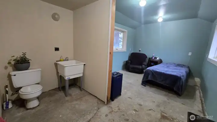 Side room off the shop with half bath- just add a shower!