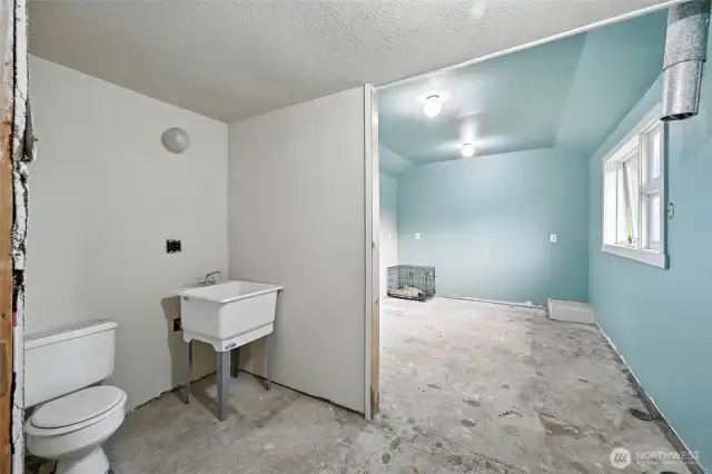 Side bonus room with toilet and sink- Just add a shower!