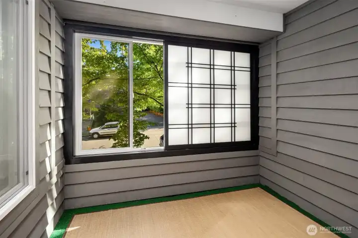 This porch has been enclosed with a window and Shoji screen for privacy but could be opened up again if someone would prefer it open.