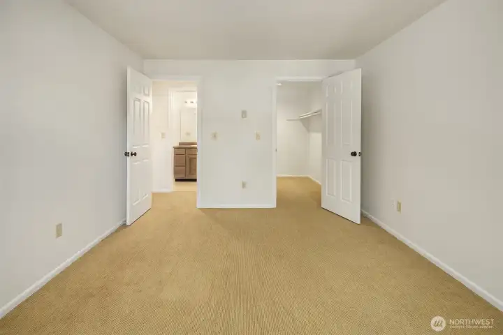View from bedroom window looking at walk-in closet on right and bathroom across the hall.