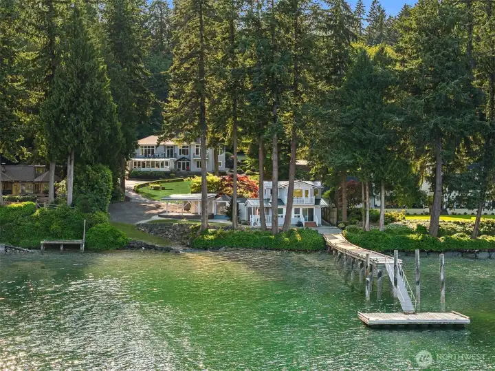 An incredibly rare waterfront compound with 2 houses! The 4300 sq ft estate quality main house and a 1300 sq ft beach house, plus a deep-water dock!